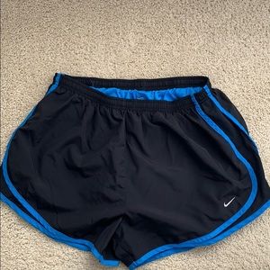 Nike running shorts with blue stripes